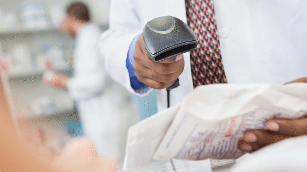 Close-up of a pharmacist scanning a prescription