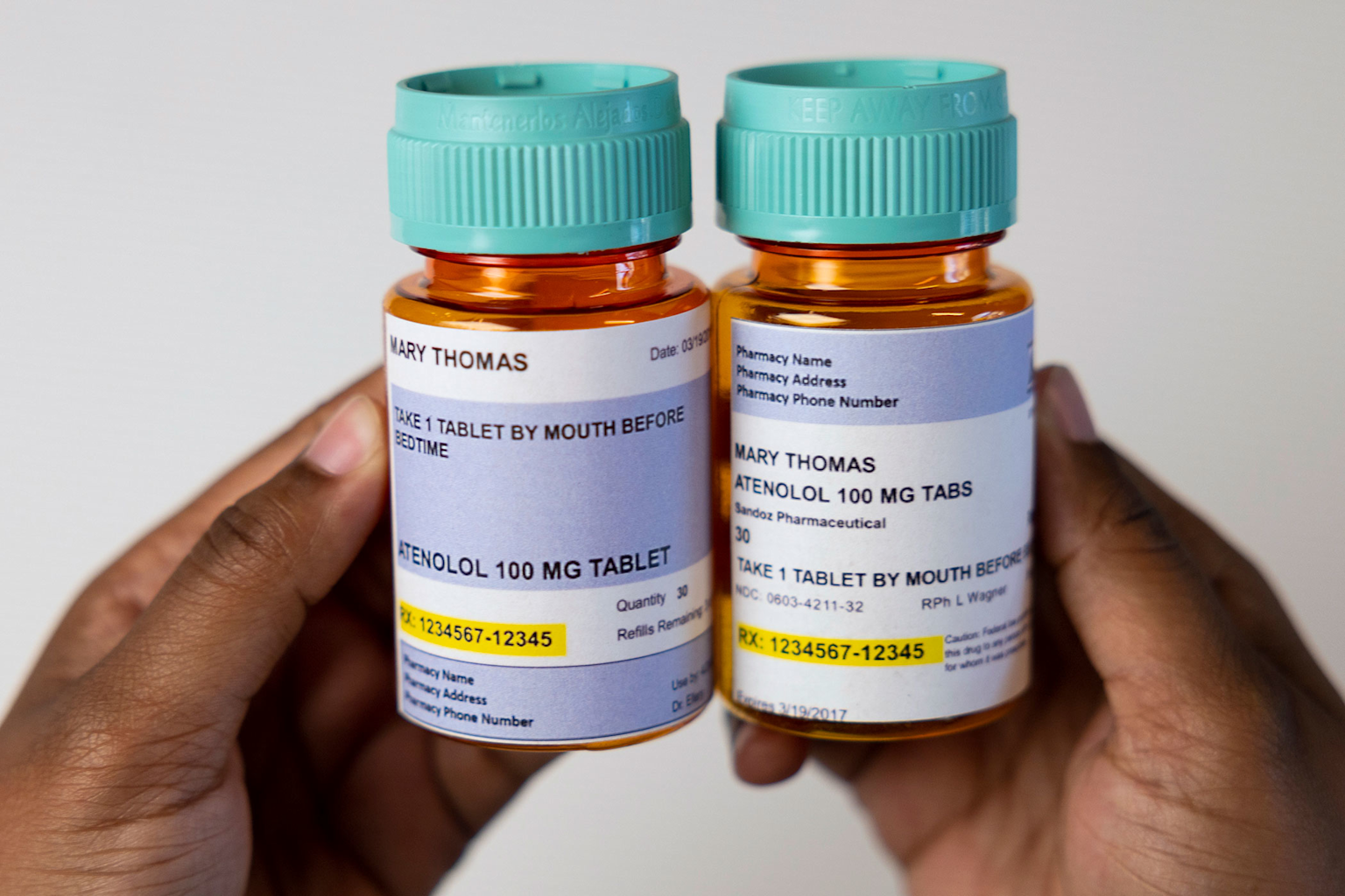 Prescription medication bottles labeled for Mary Thomas with Atenolol 100 mg and directions for use