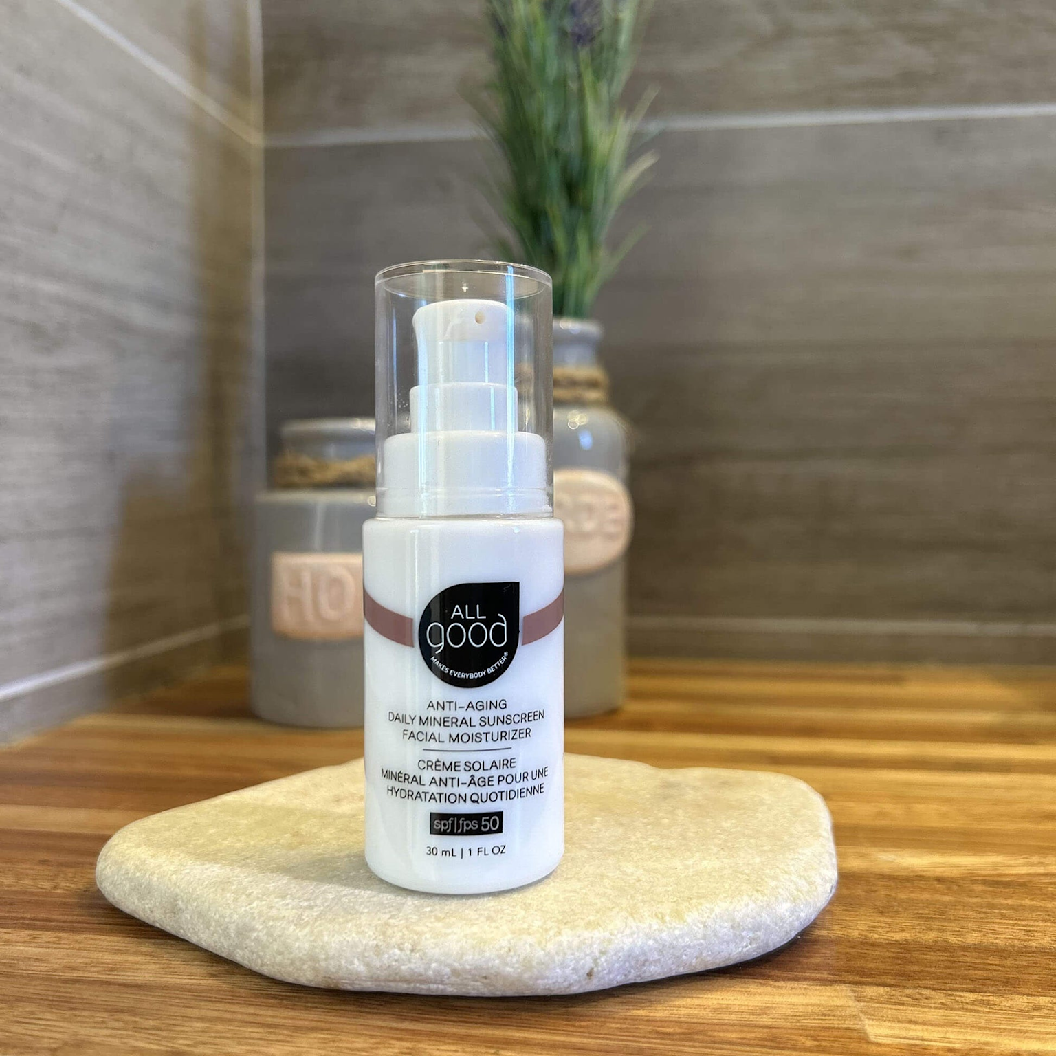 A bottle of All Good anti-aging daily mineral sunscreen and facial moisturizer with SPF 50 combines moisturizing and sun protection in one product
