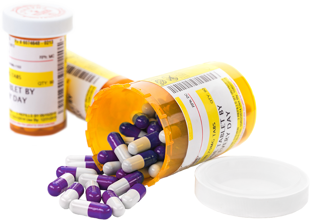 Spilled prescription pills from amber bottles illustrating pharmacy medication and prescription services