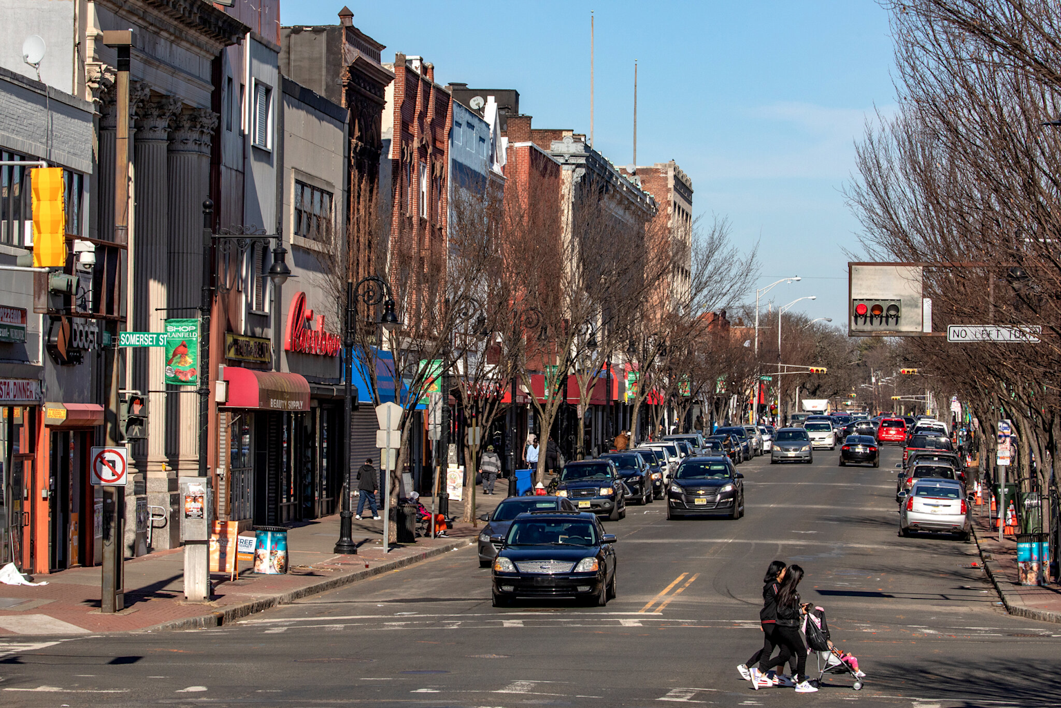 Downtown street view in South Plainfield, New Jersey, showing local shops, pedestrian activity, and traffic flow in a vibrant community area